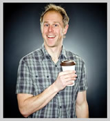 Photo of Brock drinking coffee by Dustin Delfs at Laughing Dog